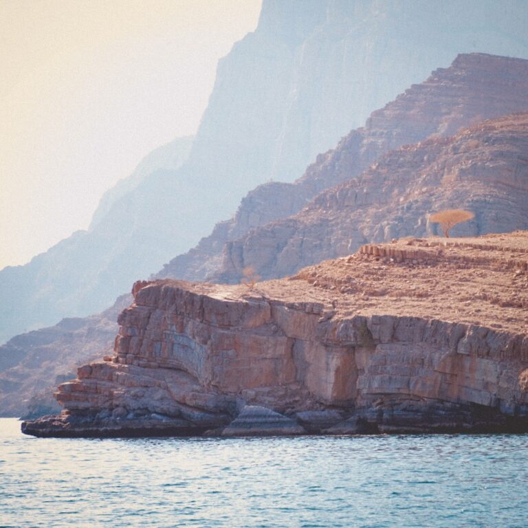 View from a boat of the fjord and steep cliffs in Musandam